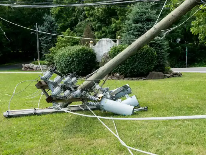 A power line has crashed into the ground after a storm
